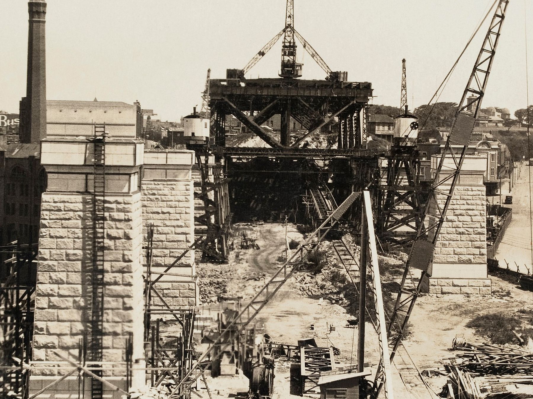 [Bridge construction showing granite on pylons] showing Quarry at Moruya used for construction of the Sydney Harbour Bridge, albums, photographs and clippings by Stanley, S.B. Purves, 1925-1927, PXD 747
